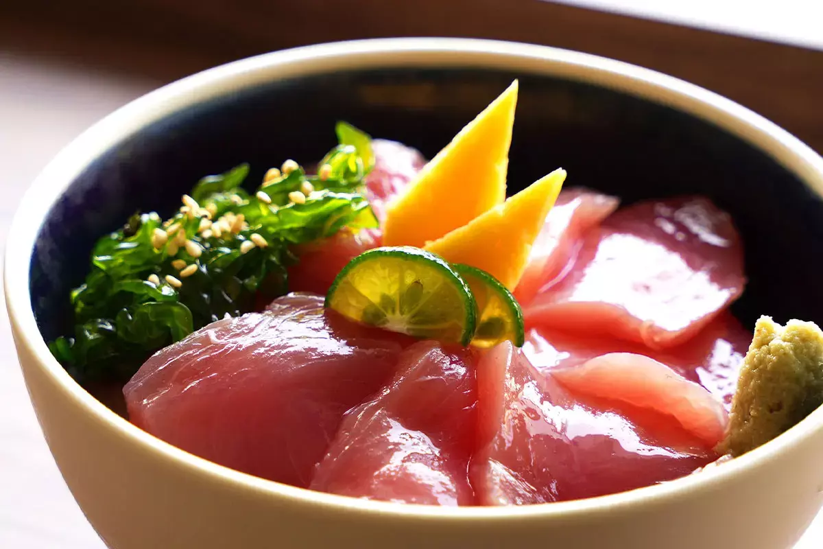 bowl of rice topped with sliced tuna